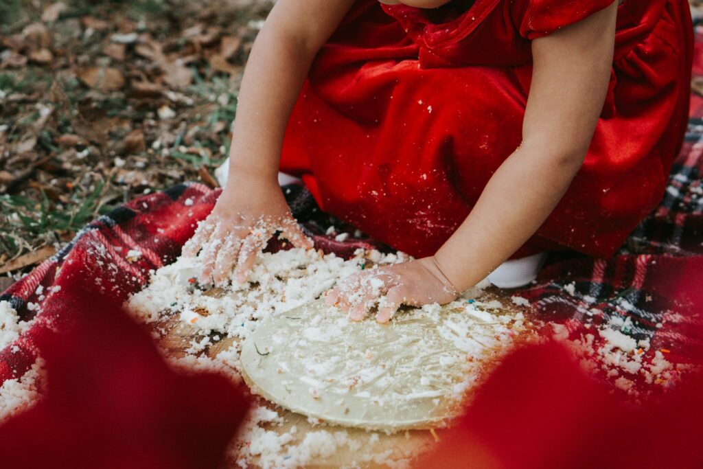 person in red shirt with white powder on her body